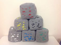 a stack of crocheted blocks sitting on top of a table