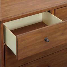 a wooden dresser with two drawers and an open drawer