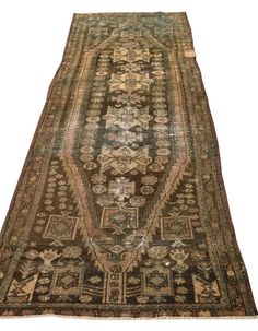 an antique persian rug is displayed on a white background with no one around it,