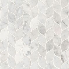 a white marble mosaic tile pattern with wavy lines in the center and diagonals on each side