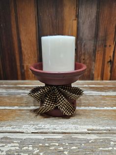 This is a listing for two separate candle holders made of terra cotta with a 2-3/4" x 2-1/2" Fresh Linen scented candle. They have been painted, stained and sealed and have a black & cream color homespun ribbon that has been stiffened to hold its shape. They both measure approx. 3-1/2" h x 4-1/4" wide at the top  Please choose either farmhouse green or barnwood red. Farmhouse Green, Primitive Farmhouse, Fresh Linen, Farmhouse Rustic, Barnwood, Terra Cotta, Scented Candle, Barn Wood, Rustic Farmhouse