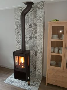 a wood burning stove sitting inside of a living room