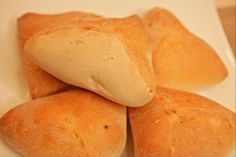 four pieces of bread sitting on top of a white plate