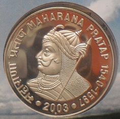 a coin with the image of a man on it is shown in front of a cloudy sky