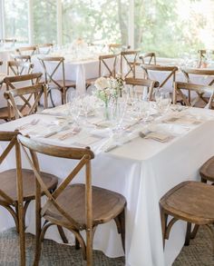 the tables are set with place settings for guests to sit down and enjoy their meal