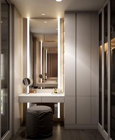 a bathroom with a vanity, mirror and stool