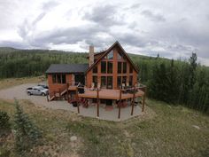 an aerial view of a house in the woods