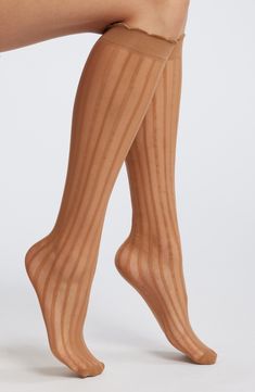 Complement your fashion-forward looks with these sheer knee-high socks punctuated with vertical stripes. Nylon/spandex Machine wash, tumble dry Imported Striped Fitted Thigh High Hosiery, Fitted Striped Knee-high Socks, Striped Stretch Thigh High Legwear, Striped Thigh High Stretch Legwear, Stretch Striped Thigh-high Legwear, Knee High Socks, Vertical Stripes, High Socks, Knee High