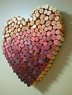 a heart made out of wine corks on a wall