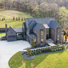 an aerial view of a large home in the country