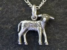 "This solid 3 Dimensional Lamb Sheep pendant is Sterling Silver. The included chain is a Sterling Silver Figaro 50 chain. You may choose 16, 18 or 20 inch at the same price. Other length available at sightly higher prices. The Lamb pendant measures 3/4\" long by 5/8\" tall.I hand cast all my pieces using the lost wax casting method. Please ask your needs. You may call me with questions, often I am out so please use my machine. 831-476-3176. Satisfaction Guaranteed! I send items USPS First Class Lamb Aesthetic, Aesthetic Necklace, Piercings Jewelry, Wax Casting, Lost Wax Casting, Funky Jewelry, The Lamb, Cool Jewelry, Pretty Jewelry