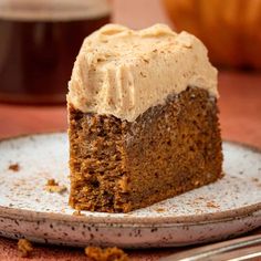 a piece of cake with frosting on a plate