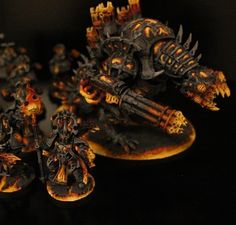 the warhammers are painted in black and orange colors, with flames coming out of them