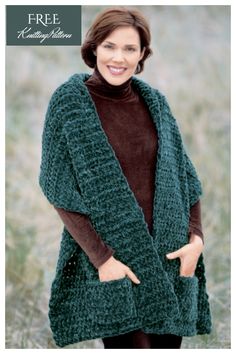 a woman wearing a green knitted cardigan and brown turtle neck sweater standing in a field