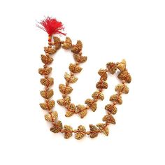 This 1 Mukhi Rudraksha Half Moon Shaped Mala is consists of 33 Rudraksha Beads of 1 Mukhi that are string in a red colored thread. 1 Mukhi Rudraksha Mala brings overall prosperity, good luck, and happiness to the Wearer. Color: Beige Brown Mix Total Beads: 32+1 Size of Beads: 27mm to 32mm Shape of Bead: Half-moon Shape Length of Mala: 18 Inches approx. *Please note that as Rudraksha is Natural Gift of nature, the pattern and color on beads might vary depending upon lot to lot. (Images shown in l Spiritual Beaded Necklaces For Festive Occasions, Handmade Spiritual Temple Necklace For Festive Occasions, Beaded Necklaces For Festive Rituals, Festive Ritual Beaded Necklaces, Festive Ritual Beaded Necklace, Festive Beaded Necklaces For Rituals, Festive Temple Jewelry Beaded Necklaces With Latkans, Gold Beaded Spiritual Temple Necklace, Festive Temple Jewelry Beaded Necklace With Latkans