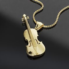 Musical Harmony Violin Necklace - A Perfect Gift for Music Lovers Add a touch of musical elegance to your outfit with this striking Violin necklace. Handcrafted with love and attention to detail, this piece is a must-have for every music lover. Whether you are a violinist, a music teacher, or just someone who loves beautiful melodies, this necklace is sure to make an impact on your heart. It makes a perfect gift for birthdays, holidays or any special occasion. Embrace the beauty of music with this unique accessory! Material:14K Gold, 925K Silver Chain: Standard size 50cm A great gift idea for Engagement, Wedding, Anniversary, Birthday, Holiday,Promise, Valentine's, Mother's Day, Christmas or Special Occasion A product will come in Nice Jelwery Box, & It Is A Very Good Option To Purchase As Violin Necklace Jewelry, Violin Necklace, Musical Jewelry, Gift For Music Lover, Violinist, Music Teacher, Music Lover, Jewelry Cleaner, Accessories Unique