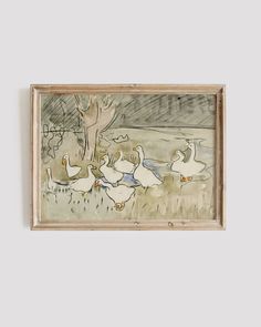 a painting hanging on the wall with ducks in it