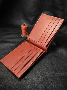 "Dear Visitor; As you see in these pictures ;You will see two types of money clip wallets. One is a single color model and the other is a double color model. You can specify the leather color combinations you want to use in your message. I can type few characters (2-3) like your initials. It is suitable for formal and casual occasions.                                                          My wallets are  made from vegetable tanned leather which is produced by https://www.sepici.com.tr/ I don't work with faux leather at all. My wallets don't have any foul or sharp smell because I reject to use any aggressive chemicals / glues which is not safe for me in the first place. My method is old style. All items and all parts are %100 handmade (cutting, painting, stitching and burnishing). No ele Brown Bifold Coin Purse With Card Slots, Classic Bifold Coin Purse With Card Slots, Brown Bifold Card Holder For Formal Use, Classic Bifold Coin Purse For Formal Use, Classic Bifold Coin Purse For Formal Occasions, Formal Handmade Rectangular Wallets, Formal Brown Bifold Card Holder, Artisan Wallets With Coin Pocket, Artisan Brown Wallets With Coin Pocket