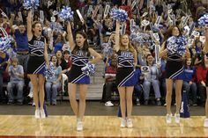 the cheerleaders are performing for the crowd