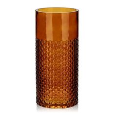 an orange glass vase sitting on top of a white table