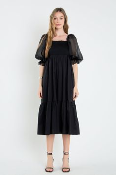 Our Mixed Media Maxi Dress is crafted with beautiful organza sleeves and breathable cotton for the bodice and skirt. The dreamy sleeves are accentuated with ruffle hems, and the smocked bodice stretches to fit you comfortably. Whether you're going to a wedding or a friend's birthday party, you'll love this flattering and flowy maxi dress. Mixed media design Organza sleeves Cotton bodice and skirt Square neckline Sheer organza 3/4 sleeves with ruffle hems Elastic on shoulders Smocked bodice Maxi length Lined skirt A-line silhouette Hand wash cold Do not bleach Do not tumble dry Iron low Exclusive of elastic Shell: 100% Cotton Contrast: 100% Polyester Lining: 80% Polyester 20% Cotton Exclusive of Elastic HN1483D Total length: 41.75" Bust: 30" S Height 5.10" / Bust 32"/ Waist 25"/ Hip 35" Square Neck Maxi Dress, Mixed Media Dress, Mixed Media Design, Organza Sleeves, Faux Shearling Jacket, Layered Sweater, English Factory, Balloon Sleeve Blouse, Flowy Maxi Dress