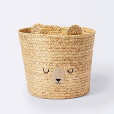 a small basket with a bear face on it