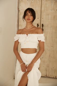 Introducing the epitome of summer sophistication, the Growing Curiosities Set in White. Elevate your vacation wardrobe with this flawless ensemble, adorned with billowy details and embellishments that embody the essence of summer living. Your perfect summer getaway deserves nothing less than this ultimate holiday attire. Crop top and skirt set, true to size Crop top, semi-lined  Ruffle details Tie on bust Ruched hem Maxi skirt, lined Elasticated waistbands Tiered with embroidered details Style slips on 100% Polyester  Non-stretch textured material Please refer to the care label on your garment for specific instructions on how to care for it Model wears XS Maxi Tiered Skirt, White Dress Flowy, Spring Break Dress, Strapless Tank Top, Crop Top And Skirt Set, Brunch Dress, Cocktail Dress Formal, Vacation Wardrobe, Holiday Attire