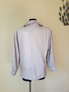 "Vtg beige genuine leather lined finnish women`s spring jacket. L size. European clothing. Scandinavian jacket with pleated shoulders and sholder pads. Large sleeves. Hipster jacket. Scandinavian leather 80s jacket. Frontal zipper and rivet buttons. 2 sides pockets. Made in Finland. Brand: Petruska condition: shabby vintage. Has some signs of wear, but no holes, no serious damages. Many spots, some ink spots on the leather surface - photo No.7, 8. no labeled size: estimated 40 EU / L size 14 UK Elegant Cream Leather Jacket, Elegant Cream Long Sleeve Leather Jacket, Elegant Long Sleeve Cream Leather Jacket, Classic Beige Leather Jacket With Long Sleeves, Cream Leather Long Sleeve Jacket For Workwear, Vintage Beige Leather Jacket With Long Sleeves, Classic Cream Long Sleeve Leather Jacket, Finnish Women, European Clothing