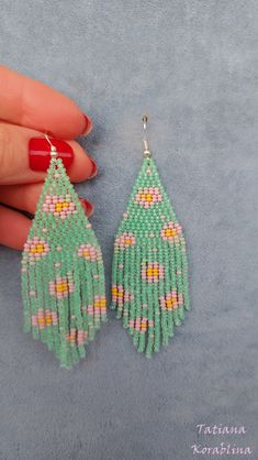 These handmade author's earrings are made of high-quality Czech beads and strong synthetic thread. In these unique earrings I use my author's scheme Flowers (Abstract minimalism). They are elegant, fashionable, and highly versatile, suitable for everyday wear. Color: base color-pastel green(mint) and other colors(pink,mint, yellow). I beg you not to copy my authoring 100% hand made with love! Measurements: Length- near 10cm(3.94inch),Width -3 cm(1.18 inch) Materials: Sterling silver components C Green Beaded Earrings As A Spring Gift, Handmade Turquoise Earrings For Spring, Handmade Dangle Earrings For Spring, Spring Dangle Beaded Earrings, Handmade Pastel Dangle Earrings, Handmade Pastel Jewelry For Spring, Green Beaded Earrings For Crafting In Summer, Handmade Green Beaded Earrings For Spring, Spring Handmade Adjustable Tassel Earrings