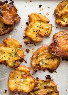 baked potatoes on a baking sheet with herbs