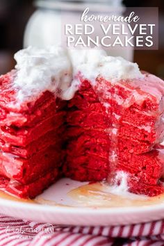 a red velvet cake with white frosting on a plate