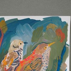 two birds are standing next to each other on a piece of paper that has been painted with acrylic paint