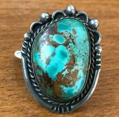 "VINTAGE NAVAJO TURQUOISE RING DESCRIPTION: This ring features a hefty specimen of Pilot Mountain turquoise. The gemstone is secure in smooth bezel, on a foundation of heavy gauge vintage sterling silver. This ring will be a treasured addition to your collection of fine vintage Native American jewelry. MEASUREMENTS: Ring face measures 1 5/8\" x 1 1/4\" Cabochon measures 32mm x 22mm RING SIZE: 8 1/4 WEIGHT: 22.6 grams SIGNED: no (Navajo) STERLING: yes, stamped STERLING" Vintage Turquoise Ring, Pencil Crafts, Pilot Mountain, Vintage Native American Jewelry, Cowgirl Jewelry, Etsy Wedding, Chrome Colour, Vintage Navajo, Vintage Turquoise