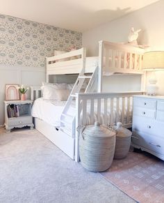 a white bunk bed sitting in a bedroom next to a dresser