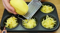 someone grating cheese into small cupcakes in a muffin tin