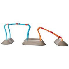 three children's toys that are sitting in the shape of an arch with two handles