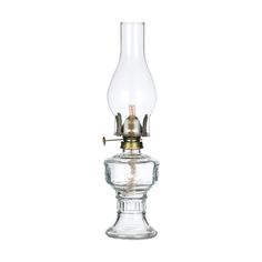 an old fashioned oil lamp with a clear glass base and brass fittings on the top