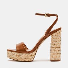 Elevate your style with these trendy brown beige woven platform block heel sandals. The chic ankle strap design and textured woven finish make them a versatile and fashionable choice. Color: Brown Beige Heel Type: Block heel Heel Height: 5'' / 127 mm approx Platform Height: 1.77'' / 45 mm approx Product measurements were taken using size 8. Please note that measurements may vary by size. Toe: Open toe Woven platform heel design Adjustable buckled ankle strap design Handcrafted US sizing. Fits true to size. Brown Chunky Platform Sandals For Party, Vacation Chunky Platform Heels With Ankle Strap, Chunky Platform Ankle Strap Heels For Vacation, Straw Open Toe Platform Heels, Chunky Platform Heels With Ankle Strap For Vacation, Open Toe Straw Platform Heels, Chic Brown Chunky Platform Heels, Chic Brown Heels For Vacation, Brown Chunky Platform Heels In Synthetic Material