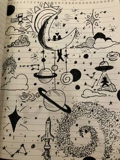 an open notebook with drawings on it and stars, planets, and other things in the sky