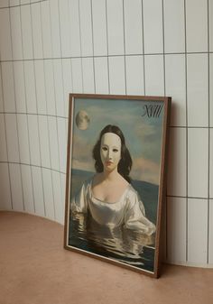 a painting on the wall next to a tiled wall