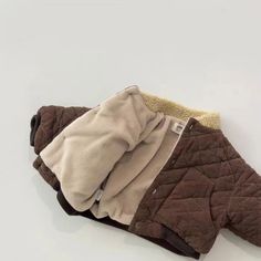 Keep your baby warm with this Thick Quilted Fleece-Lined Jacket ❄️. Perfect for winter, featuring a cozy fleece lining and quilted design. Unisex and fits ages 9-36 months. #babywinterjacket #fleecebabyjacket #quiltedbabycoat #winterbabyfashion Cotton Puffer Jacket With Fleece Lining, Winter Cotton Puffer Jacket With Fleece Lining, Brown Cotton Winter Outerwear, Brown Long Sleeve Outerwear With Plush Lining, Cozy Cotton Outerwear With Fleece Lining, Brown Quilted Cotton Outerwear, Warm Brown Cotton Outerwear, Girls Pad, Baby Boy Coat