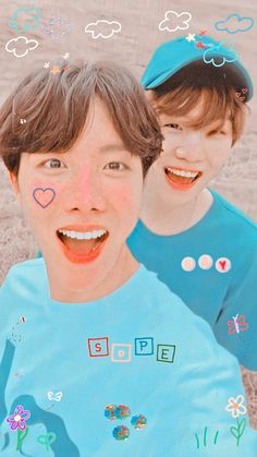 two young boys with their faces painted like clouds and hearts, smiling at the camera