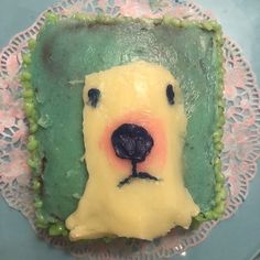 there is a cake shaped like a bear on the plate