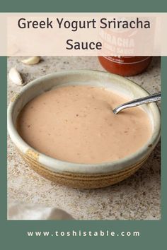 greek yogurt sriraca sauce in a bowl with a spoon on the side