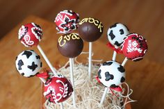 chocolate covered lollipops with pirate designs on them in a cupcake holder