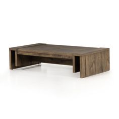 the coffee table is made from wood and has an open shelf on one side, with two