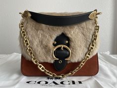 COACH Beat Brown/Brass Shoulder Bag In Suede Leather and Shearling NWT. New with tags, original dust bag included. For additional details please let me know. Thank you for looking. Designer Leather Bags For Winter, Luxury Winter Shoulder Bag, Designer Evening Bags For Winter, Luxury Leather Shoulder Bag With Faux Fur Lining, Let Me Know, Suede Leather, Dust Bag, Let Me, Thank You