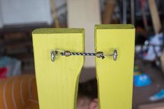 a pair of yellow wooden doors with metal handles