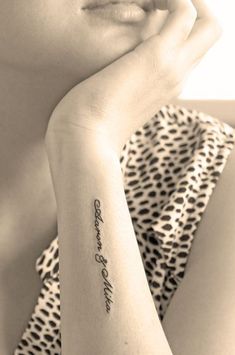 a woman with a tattoo on her arm