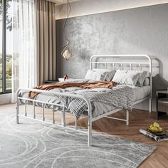 a white metal bed frame in a bedroom